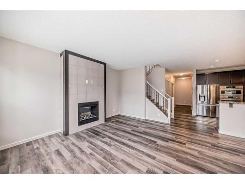 43 Legacy Row Se, Calgary, AB - Indoor Photo Showing Living Room With Fireplace