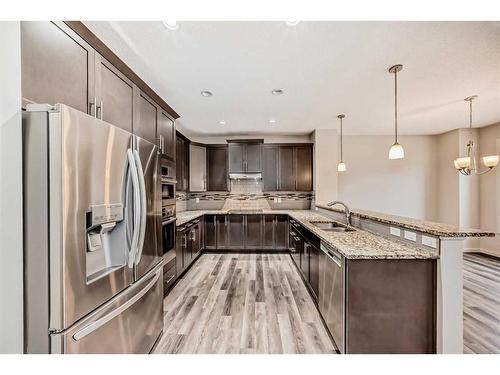 43 Legacy Row Se, Calgary, AB - Indoor Photo Showing Kitchen With Double Sink With Upgraded Kitchen