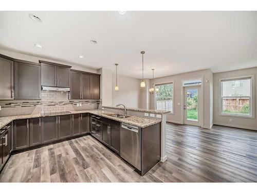 43 Legacy Row Se, Calgary, AB - Indoor Photo Showing Kitchen With Double Sink With Upgraded Kitchen