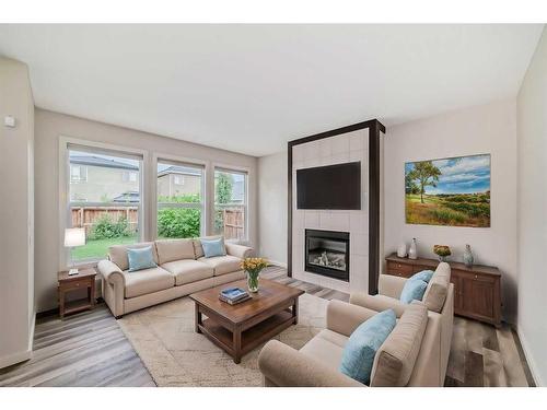 43 Legacy Row Se, Calgary, AB - Indoor Photo Showing Living Room With Fireplace