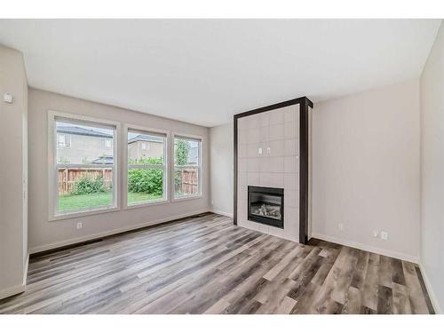 43 Legacy Row Se, Calgary, AB - Indoor Photo Showing Living Room With Fireplace