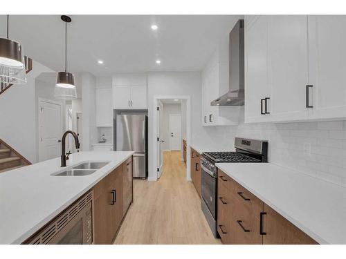 232 Belvedere Drive Se, Calgary, AB - Indoor Photo Showing Kitchen With Stainless Steel Kitchen With Double Sink With Upgraded Kitchen