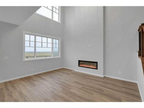 232 Belvedere Drive Se, Calgary, AB - Indoor Photo Showing Other Room With Fireplace