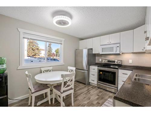 139 Woodsman Lane Sw, Calgary, AB - Indoor Photo Showing Kitchen With Stainless Steel Kitchen With Double Sink