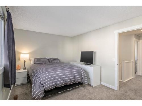 139 Woodsman Lane Sw, Calgary, AB - Indoor Photo Showing Bedroom