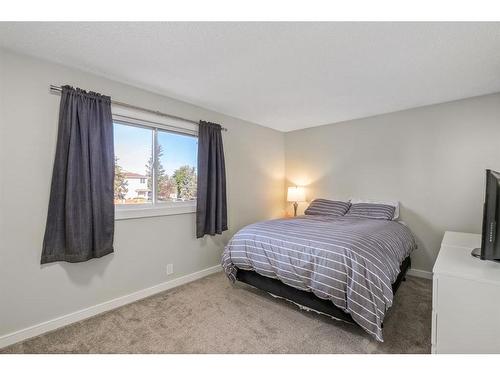 139 Woodsman Lane Sw, Calgary, AB - Indoor Photo Showing Bedroom