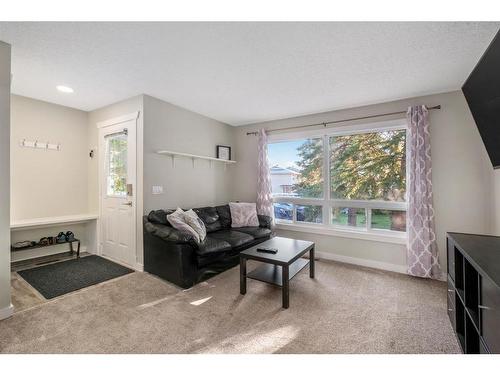 139 Woodsman Lane Sw, Calgary, AB - Indoor Photo Showing Living Room