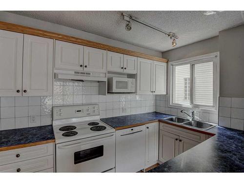 203-126 24 Avenue Sw, Calgary, AB - Indoor Photo Showing Kitchen With Double Sink