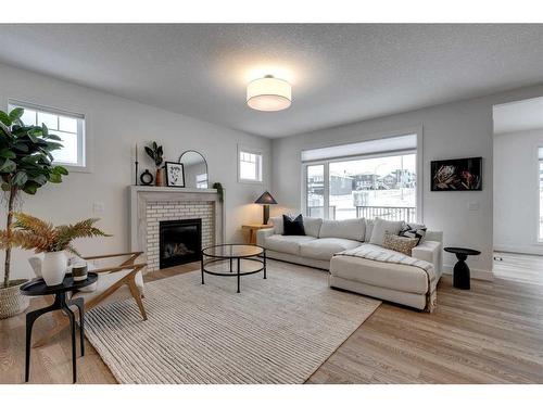 30 Fireside Point, Cochrane, AB - Indoor Photo Showing Living Room With Fireplace