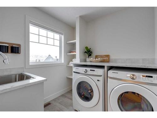 30 Fireside Point, Cochrane, AB - Indoor Photo Showing Laundry Room