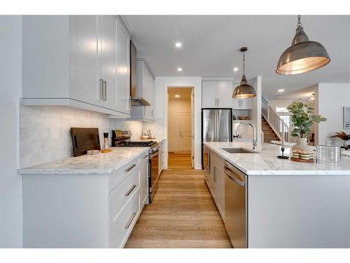 30 Fireside Point, Cochrane, AB - Indoor Photo Showing Kitchen With Upgraded Kitchen