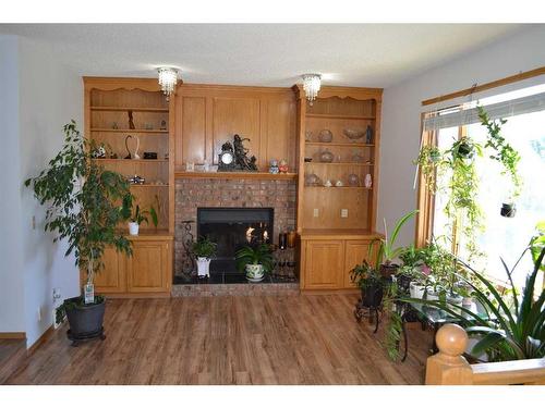 509 Hawkstone Drive Nw, Calgary, AB - Indoor Photo Showing Living Room With Fireplace