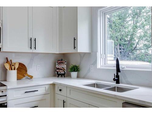 16 Hawktree Close Nw, Calgary, AB - Indoor Photo Showing Kitchen With Double Sink