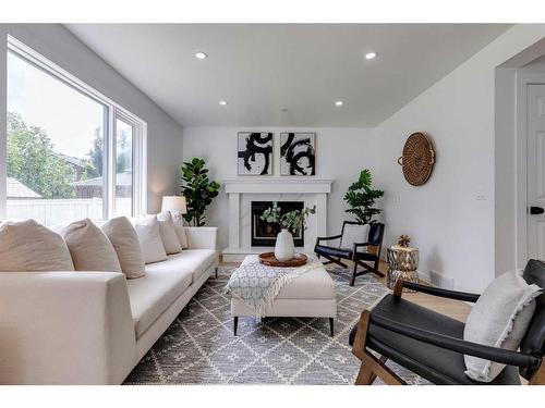 16 Hawktree Close Nw, Calgary, AB - Indoor Photo Showing Living Room With Fireplace