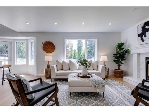 16 Hawktree Close Nw, Calgary, AB - Indoor Photo Showing Living Room With Fireplace