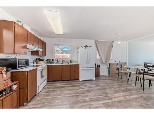 5 Spruce Drive, Drumheller, AB - Indoor Photo Showing Kitchen With Double Sink