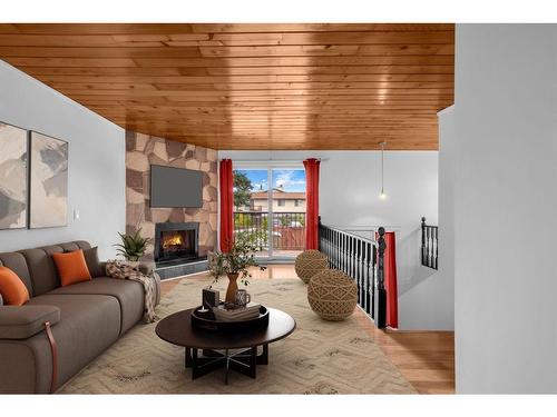 C-1407 44 Street Ne, Calgary, AB - Indoor Photo Showing Living Room With Fireplace