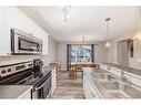 122 Silverado Range View Sw, Calgary, AB  - Indoor Photo Showing Kitchen With Double Sink 