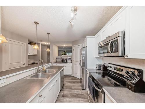 122 Silverado Range View Sw, Calgary, AB - Indoor Photo Showing Kitchen With Double Sink