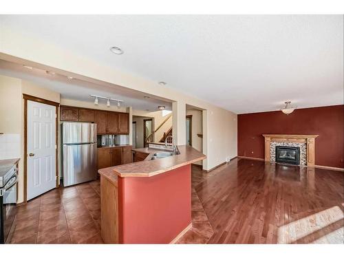 180 West Creek Drive, Chestermere, AB - Indoor Photo Showing Other Room With Fireplace