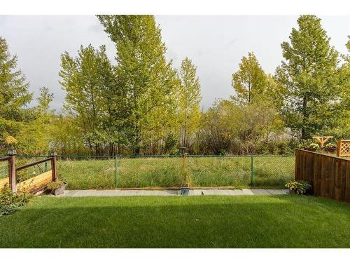 51 Everridge Villas Sw, Calgary, AB - Outdoor With Backyard