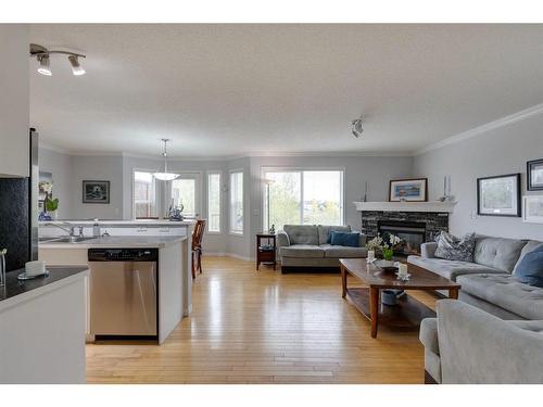 51 Everridge Villas Sw, Calgary, AB - Indoor Photo Showing Living Room With Fireplace