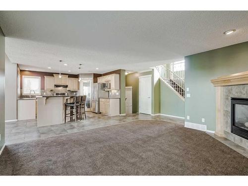 50 Somerside Crescent Sw, Calgary, AB - Indoor Photo Showing Living Room With Fireplace