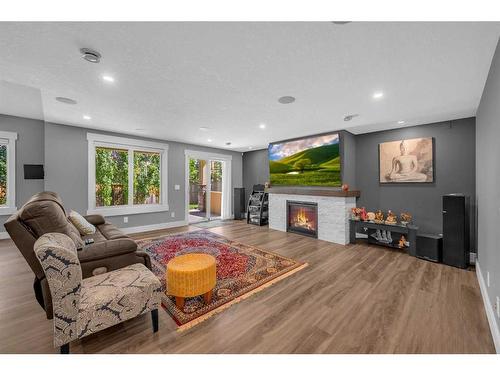 57 Rockcliff Heights Nw, Calgary, AB - Indoor Photo Showing Living Room With Fireplace