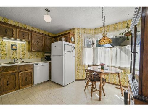 56-10910 Bonaventure Drive Se, Calgary, AB - Indoor Photo Showing Kitchen With Double Sink