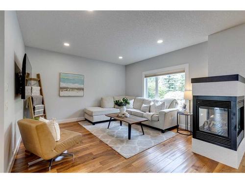 7866 Springbank Way Sw, Calgary, AB - Indoor Photo Showing Living Room With Fireplace