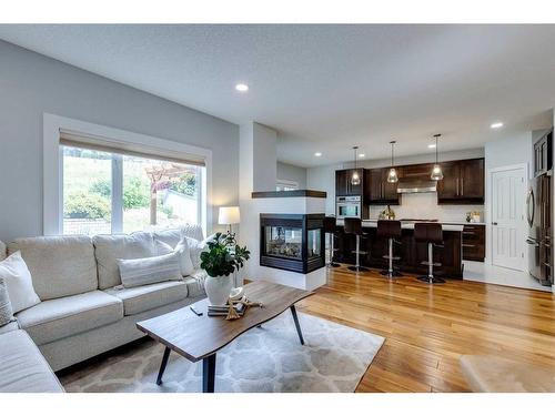 7866 Springbank Way Sw, Calgary, AB - Indoor Photo Showing Living Room With Fireplace