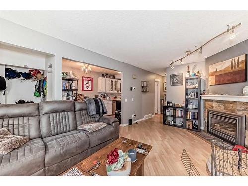 28-5315 53 Avenue Nw, Calgary, AB - Indoor Photo Showing Living Room With Fireplace