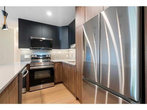 1712 Edenwold Heights Nw, Calgary, AB - Indoor Photo Showing Kitchen With Stainless Steel Kitchen