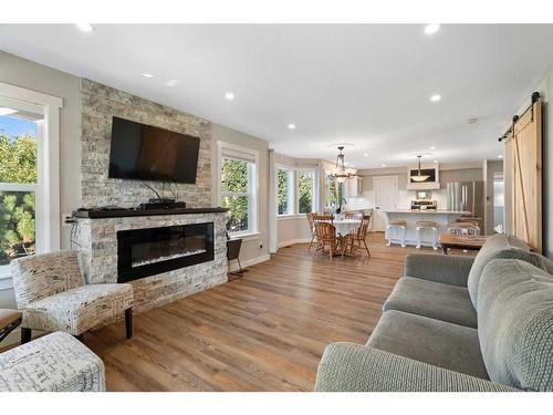 25 2 Street Se, High River, AB - Indoor Photo Showing Living Room With Fireplace