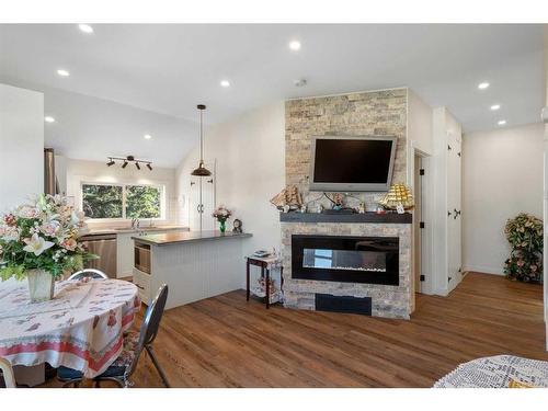 25 2 Street Se, High River, AB - Indoor Photo Showing Living Room With Fireplace