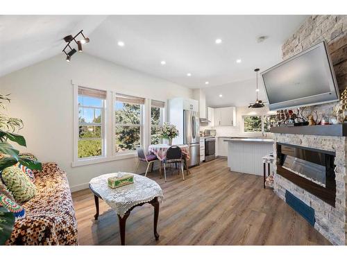 25 2 Street Se, High River, AB - Indoor Photo Showing Living Room With Fireplace