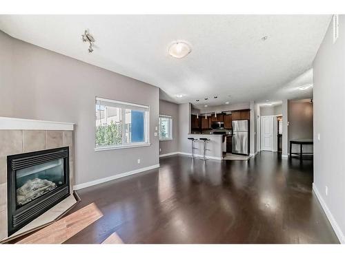 205-509 21 Avenue Sw, Calgary, AB - Indoor Photo Showing Living Room With Fireplace