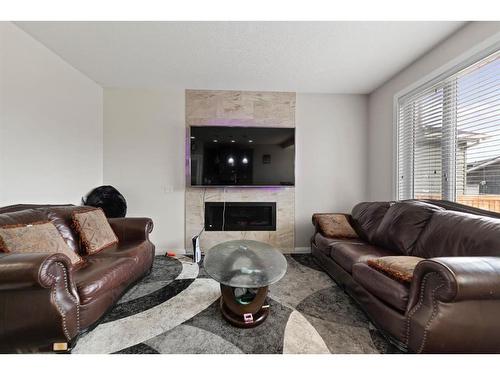 113 Redstone Park Ne, Calgary, AB - Indoor Photo Showing Living Room With Fireplace