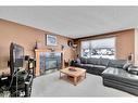 132 Tuscany Hills Circle Nw, Calgary, AB  - Indoor Photo Showing Living Room With Fireplace 