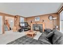 132 Tuscany Hills Circle Nw, Calgary, AB  - Indoor Photo Showing Living Room With Fireplace 