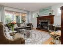 7 Tuscany Estates Close Nw, Calgary, AB  - Indoor Photo Showing Living Room With Fireplace 