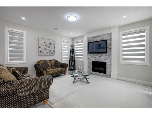 229 Walgrove Terrace Se, Calgary, AB - Indoor Photo Showing Living Room With Fireplace