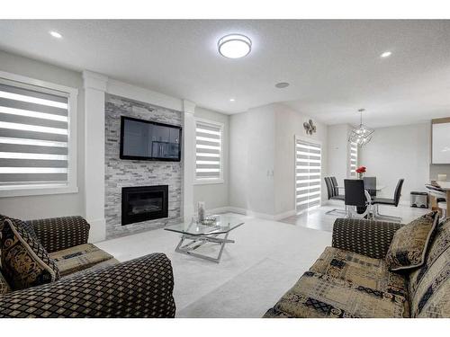 229 Walgrove Terrace Se, Calgary, AB - Indoor Photo Showing Living Room With Fireplace