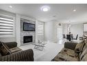 229 Walgrove Terrace Se, Calgary, AB  - Indoor Photo Showing Living Room With Fireplace 