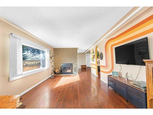 236 Huntwell Court Ne, Calgary, AB - Indoor Photo Showing Living Room With Fireplace