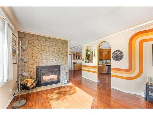 236 Huntwell Court Ne, Calgary, AB - Indoor Photo Showing Living Room With Fireplace