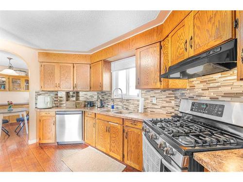 236 Huntwell Court Ne, Calgary, AB - Indoor Photo Showing Kitchen With Double Sink