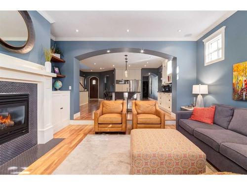 2031 Bowness Road Nw, Calgary, AB - Indoor Photo Showing Living Room With Fireplace