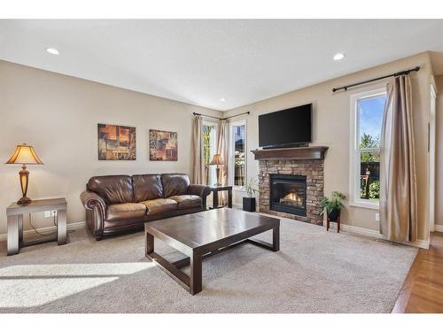 11 Silverado Skies Lane Sw, Calgary, AB - Indoor Photo Showing Living Room With Fireplace