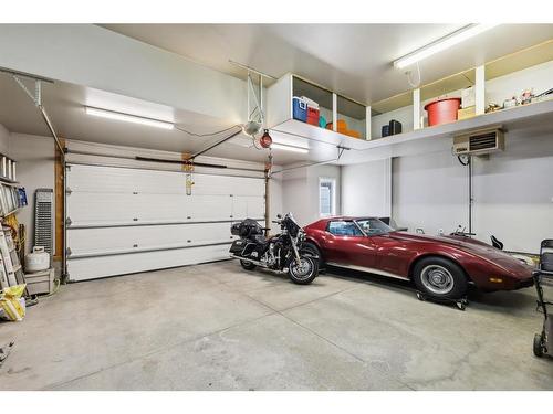 11 Silverado Skies Lane Sw, Calgary, AB - Indoor Photo Showing Garage